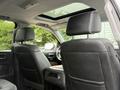 The interior of a 2017 Chevrolet Silverado 1500 showcasing two black leather front seats and a visible sunroof above