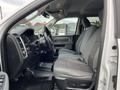 Interior view of a 2015 RAM 2500 showing front seats and dashboard with a gray fabric seating arrangement