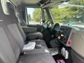 Interior of a 2012 International 7300 Workstar showing driver's seat passenger seat and dashboard with controls and storage compartments