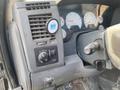 Control panel of a 2009 Dodge Ram 5500 featuring dials and buttons for lights and ventilation