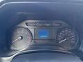 Dashboard of a 2018 Ford F-350 displaying speedometer tachometer and trip information with a digital screen showing 163457 km