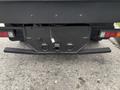 A 2015 Mitsubishi Fuso FE160 with a rear view showing the back bumper and hitch assembly
