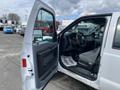 A 2015 Ford F-550 with an open driver's side door revealing the interior and seats
