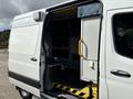 A 2020 Mercedes-Benz Sprinter 2500 with an open side door revealing interior storage compartments and a step leading inside