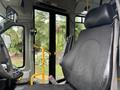 The image shows the driver's seat of a 2018 Chevrolet Express with a focus on the seat design and controls visible in the foreground