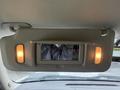A sun visor with a mirror and lights is visible in a 2013 Chevrolet Silverado 3500HD