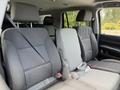 Interior view of a 2017 Chevrolet Tahoe featuring gray upholstered seats with seatbelts visible in the foreground
