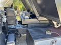 2016 Isuzu NPR-HD with an open engine compartment exposing the engine and components including a large black box and wiring