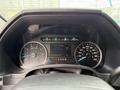 Dashboard of a 2018 Ford F-150 showing speedometer and fuel gauge with digital display for engine information and gear selection indicators