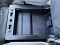 A black plastic storage compartment from the center console of a 2017 Ford F-550 with no items inside