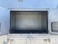 An empty storage compartment of a 2008 Workhorse W62 vehicle showing metal interior and no items inside
