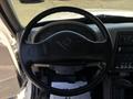 The image shows the steering wheel and dashboard of a 2008 International DuraStar with gauges and controls visible around the steering column