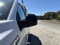 A 2019 Ford F-150 showcasing its side mirror and a portion of the door in a close-up view