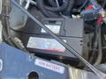 A 2013 Chevrolet Express vehicle battery is visible in the engine compartment with various wires and components surrounding it