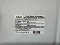 A 2018 Ford F-150 vehicle emission control information label displaying various specifications and compliance details