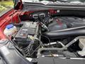 A 2019 Ford F-150 engine compartment showing the battery and various engine components with visible wires and hoses