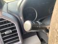 A close-up of the turn signal stalk in a 2016 Ford F-150 showing various control functions
