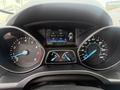 Dashboard display of a 2014 Ford Escape showing trip information speedometer and fuel gauge