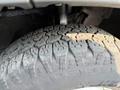 Close-up of a rugged tire from a 2017 RAM Promaster showcasing its tread pattern and wear