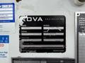 A black and silver identification label displaying the make and model of a vehicle along with serial and unit numbers and expiration dates