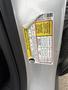 Close-up of a 2014 Ford Escape driver side door sticker showing vehicle information including weight capacity and tire specifications