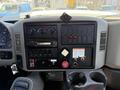 Dashboard of a 2013 International 7400 featuring gauges buttons knobs and a stereo system