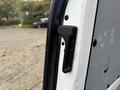 Detail of the door handle on a 2021 Mercedes-Benz Metris showing the latch mechanism and surrounding frame