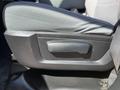 A close-up view of the seat adjustment lever in a 2015 RAM 1500 pickup truck interior