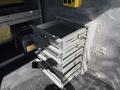 A set of metal sliding drawers installed in a vehicle showcasing multiple levels of storage compartments