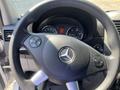 Steering wheel of a 2016 Mercedes-Benz Sprinter featuring the brand logo at the center and control buttons on the side