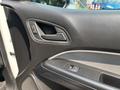 Door panel of a 2017 Chevrolet Colorado featuring a sleek design with a window control switch and a door handle
