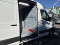 A 2021 Mercedes-Benz Sprinter 2500 van with an open side door revealing the empty cargo area