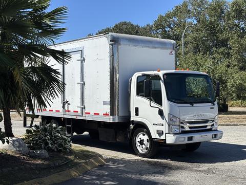 A white 2022 Isuzu NQR box truck with a silver cargo area and black tires parked at an angle