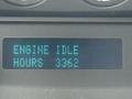 A digital display showing the message ENGINE IDLE and the number of hours as 3362 on a 2015 Ford F-350 SD