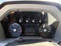 A close-up view of the dashboard of a 2014 Ford F-250 SD displaying various gauges including speedometer and fuel level indicators