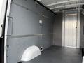Interior of a 2023 Mercedes-Benz Sprinter cargo van featuring smooth walls and a spacious floor area with no additional fittings or partitions visible