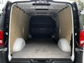 Interior view of a 2020 Mercedes-Benz Metris cargo van showing a spacious empty load area with wooden paneling and minimal features