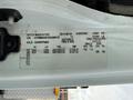 Label on a 2013 International Durastar 4300 providing information about the vehicle's axle, tire size, load capacity, and tire pressure specifications