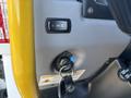 Close-up of the control panel of a 2022 Lion Lion6 featuring a switch for lights and an ignition keyhole with a key attached