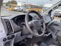 Interior view of a 2017 Ford Transit showing the steering wheel dashboard and control panel
