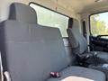 Two gray cloth seats positioned side by side inside a 2020 Hino 338 truck cabin