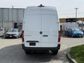 White 2023 Mercedes-Benz Sprinter van viewed from the rear with a smooth surface and a large cargo area
