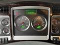 Dashboard of a 2018 Kenworth T800 showing speedometer, tachometer, fuel gauge and engine temperature gauge with digital display indicating time and other metrics