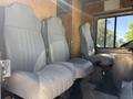 Interior view of a 2009 Morgan Olson Workhorse W62 featuring three gray upholstered driver and passenger seats