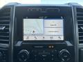 Interior dashboard of a 2019 Ford F-550 displaying a touchscreen interface with navigation and audio controls