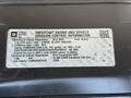 A 2015 GMC Savana emission control information label detailing engine specifications and fuel type