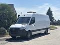A white 2019 Mercedes-Benz Sprinter van with a high roof and no visible markings parked on a street