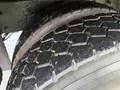 Close-up of a tire from a 2016 International 7400 showcasing the tread pattern and rubber texture