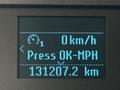 Dashboard display of a 2018 Ford F-150 showing speed in kilometers per hour and total distance of 131207.2 kilometers