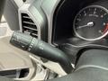 A close-up of the steering column and control stalk of a 2020 Ford F-550 showing the turn signal and windshield wiper controls along with the instrument cluster